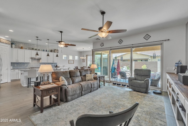 22927 E Via Del Oro, Queen Creek, AZ 85142 - living room featuring a ceiling fan, recessed lighting, and light wood-style floors