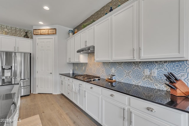 22927 E Via Del Oro, Queen Creek, AZ 85142 - kitchen with stainless steel appliances, under cabinet range hood, white cabinets, light wood finished floors, and recessed lighting
