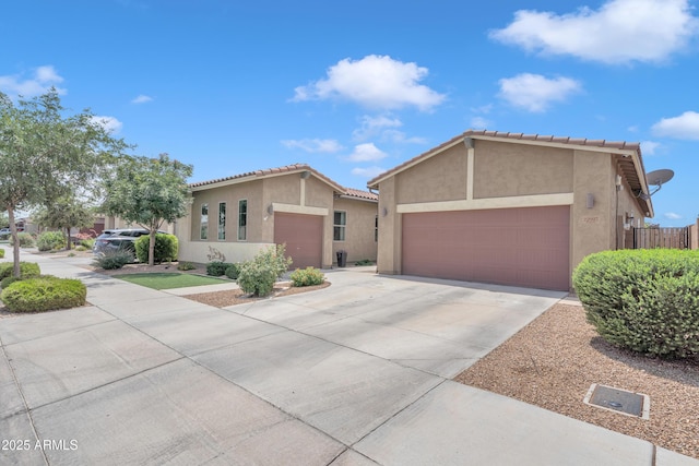 22927 E Via Del Oro, Queen Creek, AZ 85142 - mediterranean / spanish-style home featuring a garage, stucco siding, concrete driveway, and a tiled roof