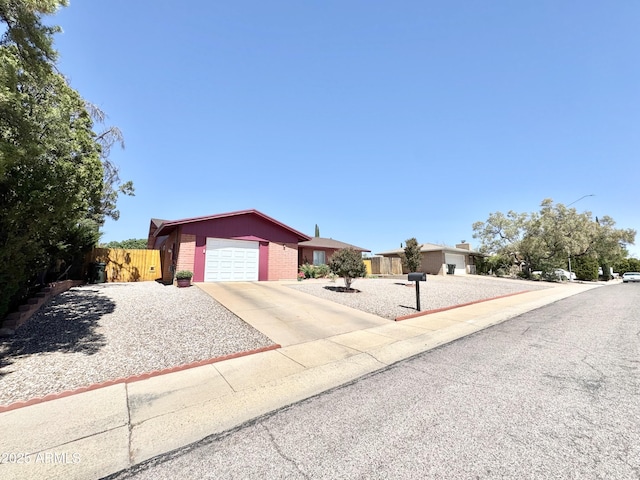 1081 Cholla Cir, Sierra Vista, AZ 85635 - ranch-style home featuring brick siding, driveway, and an attached garage