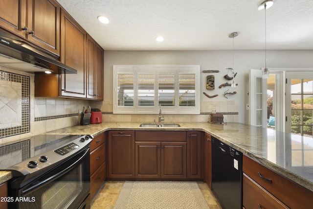 kitchen featuring backsplash, a sink, under cabinet range hood, and black appliances