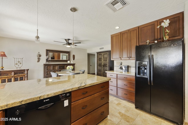 kitchen with a textured ceiling, black appliances, backsplash, and visible vents