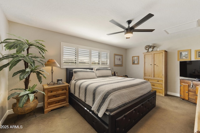 carpeted bedroom with baseboards and a ceiling fan