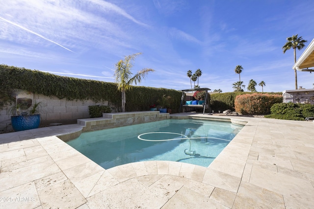 view of swimming pool featuring a fenced in pool, a patio area, and a fenced backyard