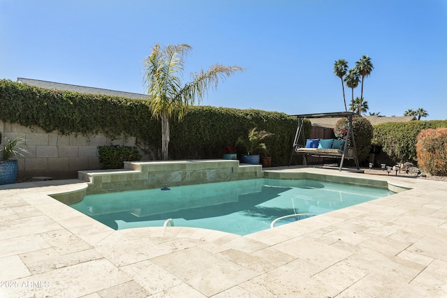 view of pool featuring a fenced in pool, a fenced backyard, and a patio