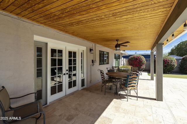 view of patio featuring french doors, ceiling fan, and outdoor dining area