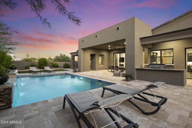 view of patio terrace at dusk