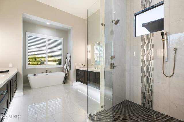 bathroom with vanity, tile patterned flooring, and independent shower and bath