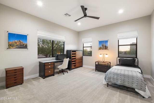 carpeted bedroom featuring ceiling fan