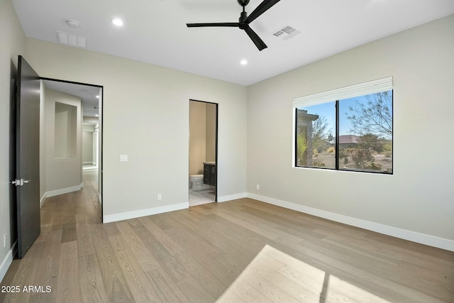 unfurnished bedroom with ceiling fan, connected bathroom, and light hardwood / wood-style flooring