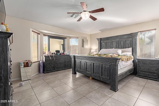 bedroom featuring ceiling fan and light tile patterned floors