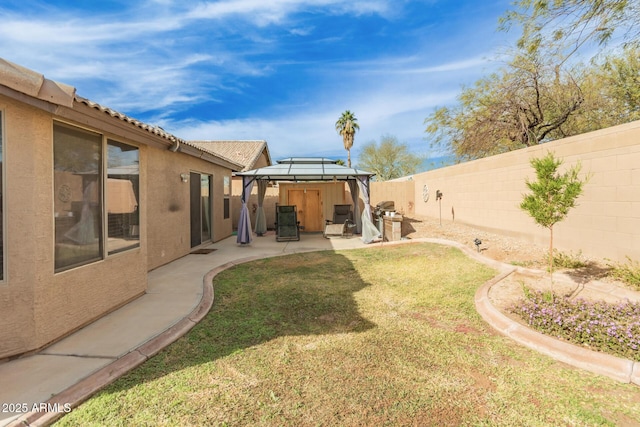 view of yard with a gazebo and a patio area