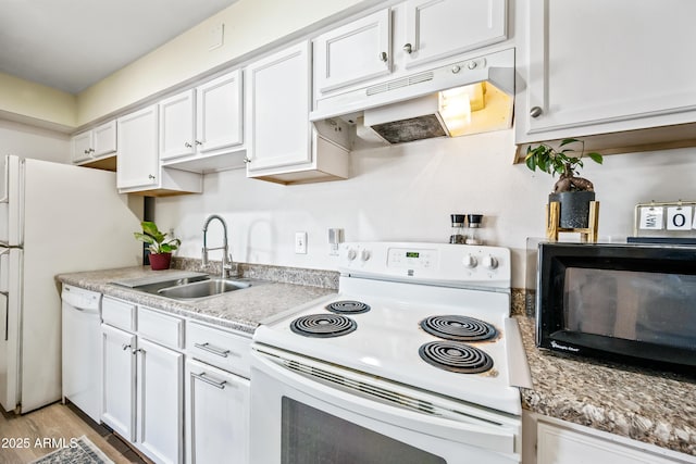 kitchen featuring white appliances, under cabinet range hood, a sink, white cabinets, and light countertops