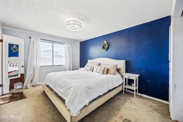 bedroom featuring carpet, a textured ceiling, and baseboards