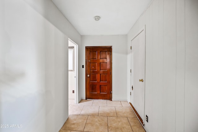 doorway to outside featuring light tile patterned floors
