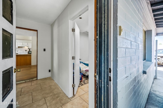 corridor with light tile patterned floors