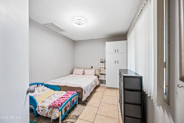bedroom featuring light tile patterned floors