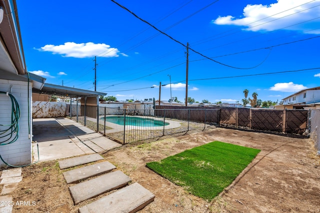 view of swimming pool with a patio area and a fenced backyard