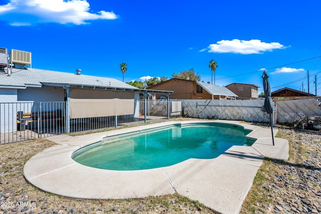 view of swimming pool with a fenced backyard, cooling unit, and a patio area