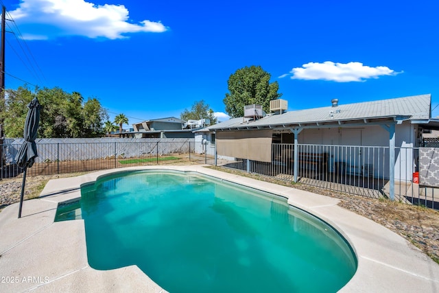 view of swimming pool featuring a fenced backyard, central AC unit, and a patio area