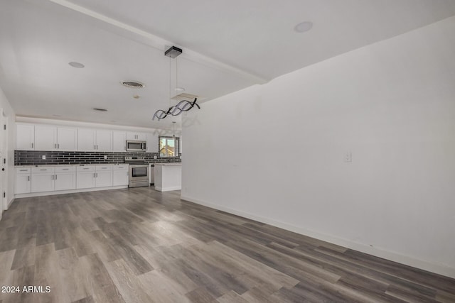 unfurnished living room featuring hardwood / wood-style floors