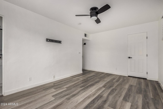 spare room with ceiling fan and wood-type flooring