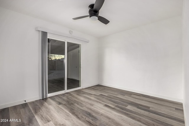 empty room featuring ceiling fan and hardwood / wood-style floors