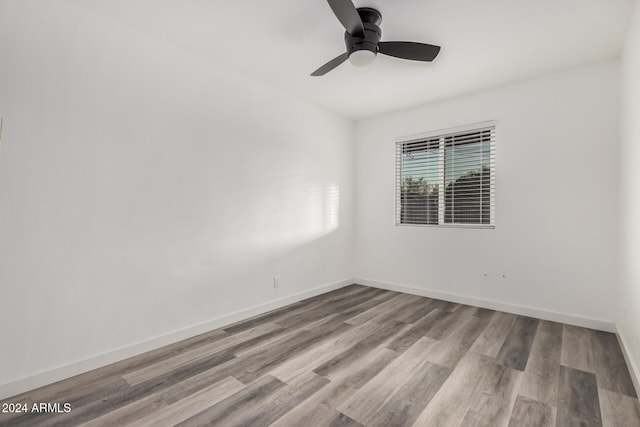 unfurnished room featuring light wood-type flooring and ceiling fan