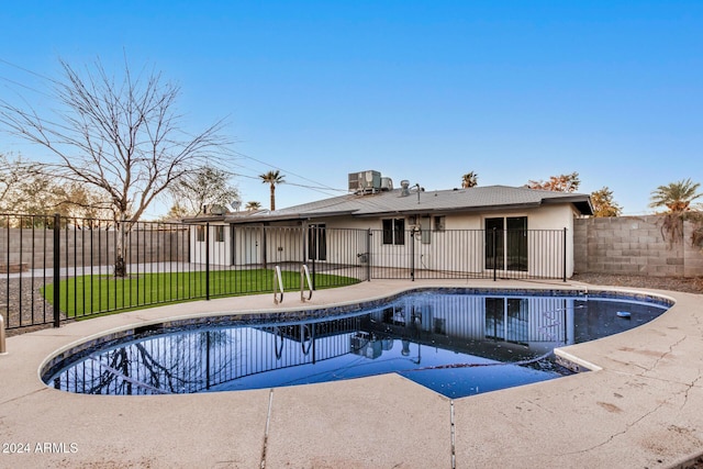 view of pool featuring a yard, a patio, and cooling unit