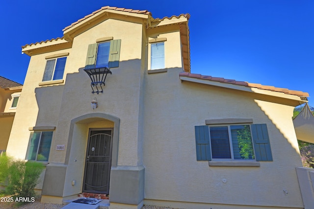 14861 W Ashland Ave, Goodyear, AZ 85395 - mediterranean / spanish-style home featuring a tiled roof and stucco siding