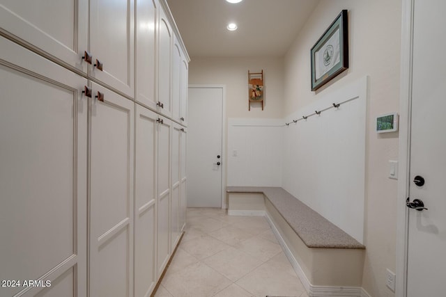 mudroom with light tile patterned floors