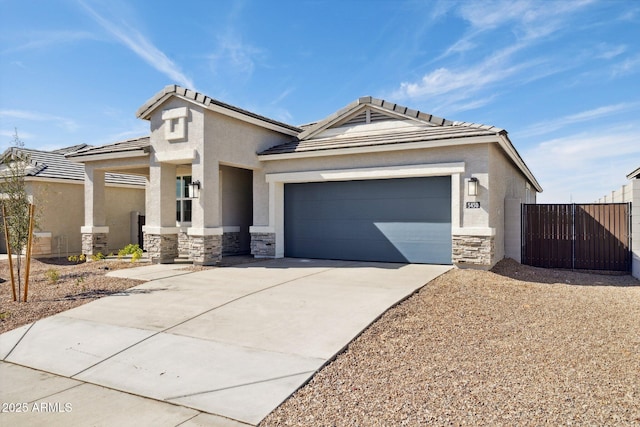 view of front of property with stucco siding, stone siding, and concrete driveway