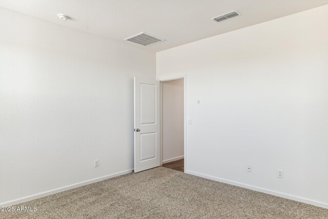 25431 W Graham Trl, Buckeye, AZ 85326 - empty room featuring visible vents, baseboards, and carpet