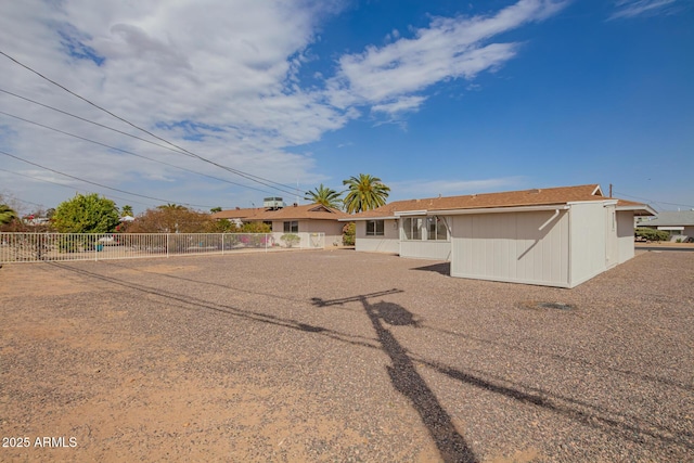 ranch-style home with fence