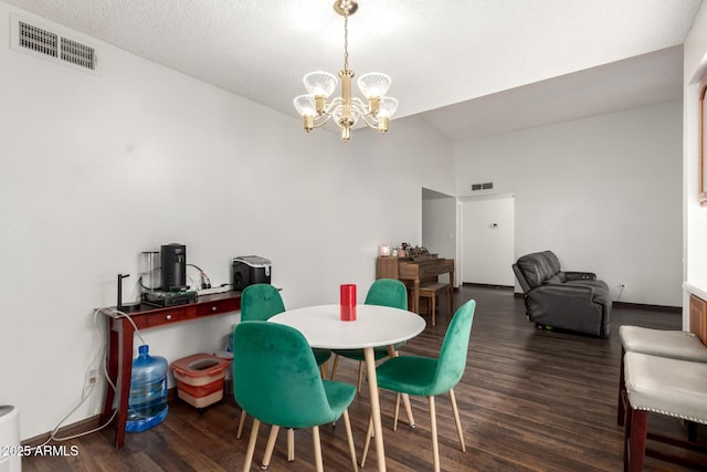 6207 N 21st Dr, Phoenix, AZ 85015 - dining space featuring baseboards, visible vents, wood finished floors, and an inviting chandelier