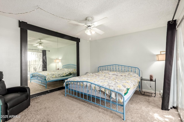 6207 N 21st Dr, Phoenix, AZ 85015 - bedroom with ceiling fan, a textured ceiling, a closet, and carpet