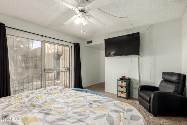 6207 N 21st Dr, Phoenix, AZ 85015 - bedroom featuring carpet flooring, baseboards, visible vents, a ceiling fan, and a textured ceiling