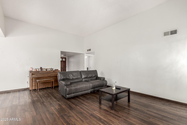6207 N 21st Dr, Phoenix, AZ 85015 - living area featuring a towering ceiling, visible vents, dark wood finished floors, and baseboards