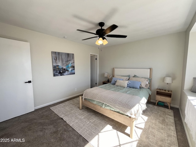 bedroom featuring ceiling fan and dark colored carpet