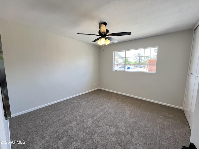 carpeted empty room with ceiling fan