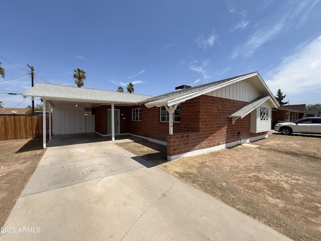 single story home featuring a carport