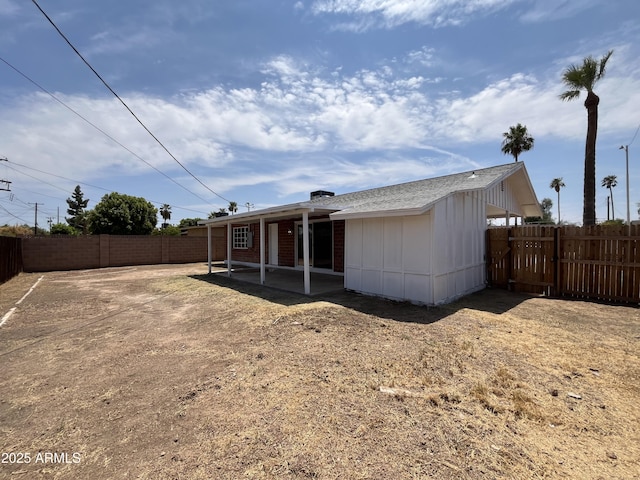 back of property with a patio area