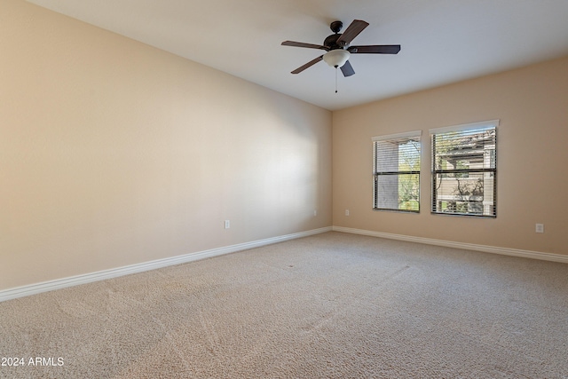 unfurnished room with ceiling fan and carpet floors