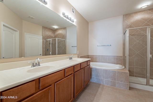 bathroom featuring tile patterned flooring, vanity, and separate shower and tub