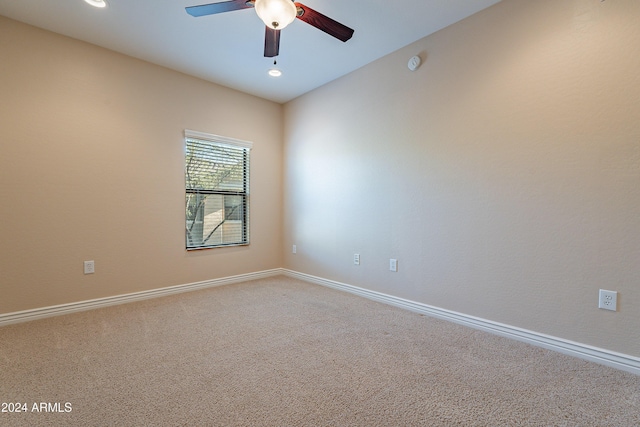 empty room featuring carpet and ceiling fan