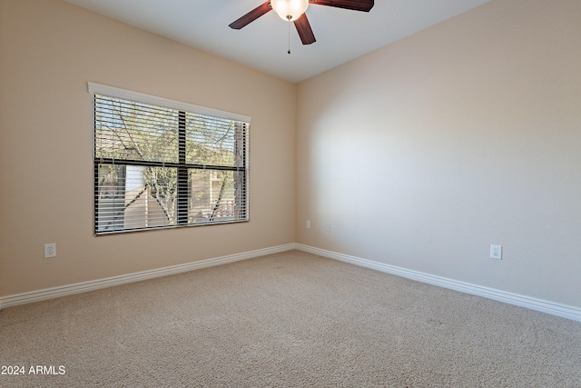 carpeted empty room with ceiling fan