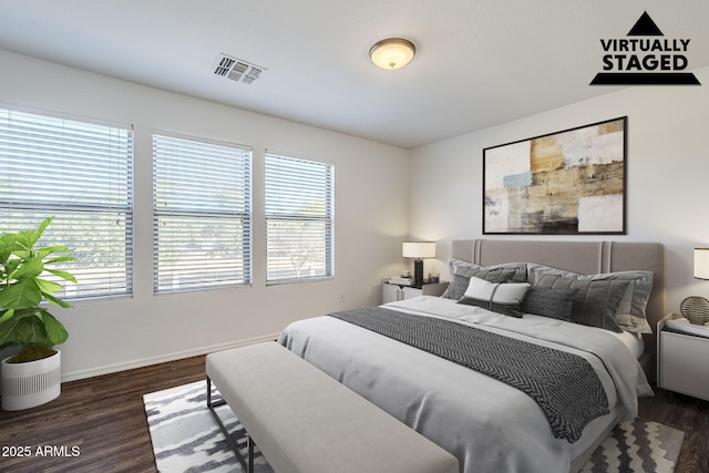 bedroom with dark wood-type flooring