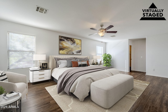 bedroom featuring ceiling fan and dark hardwood / wood-style flooring