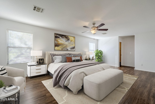 bedroom featuring dark hardwood / wood-style flooring and ceiling fan