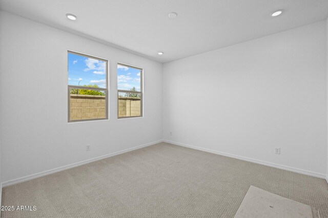 15788 W Georgia Dr W, Surprise, AZ 85379 - empty room featuring light carpet, recessed lighting, and baseboards